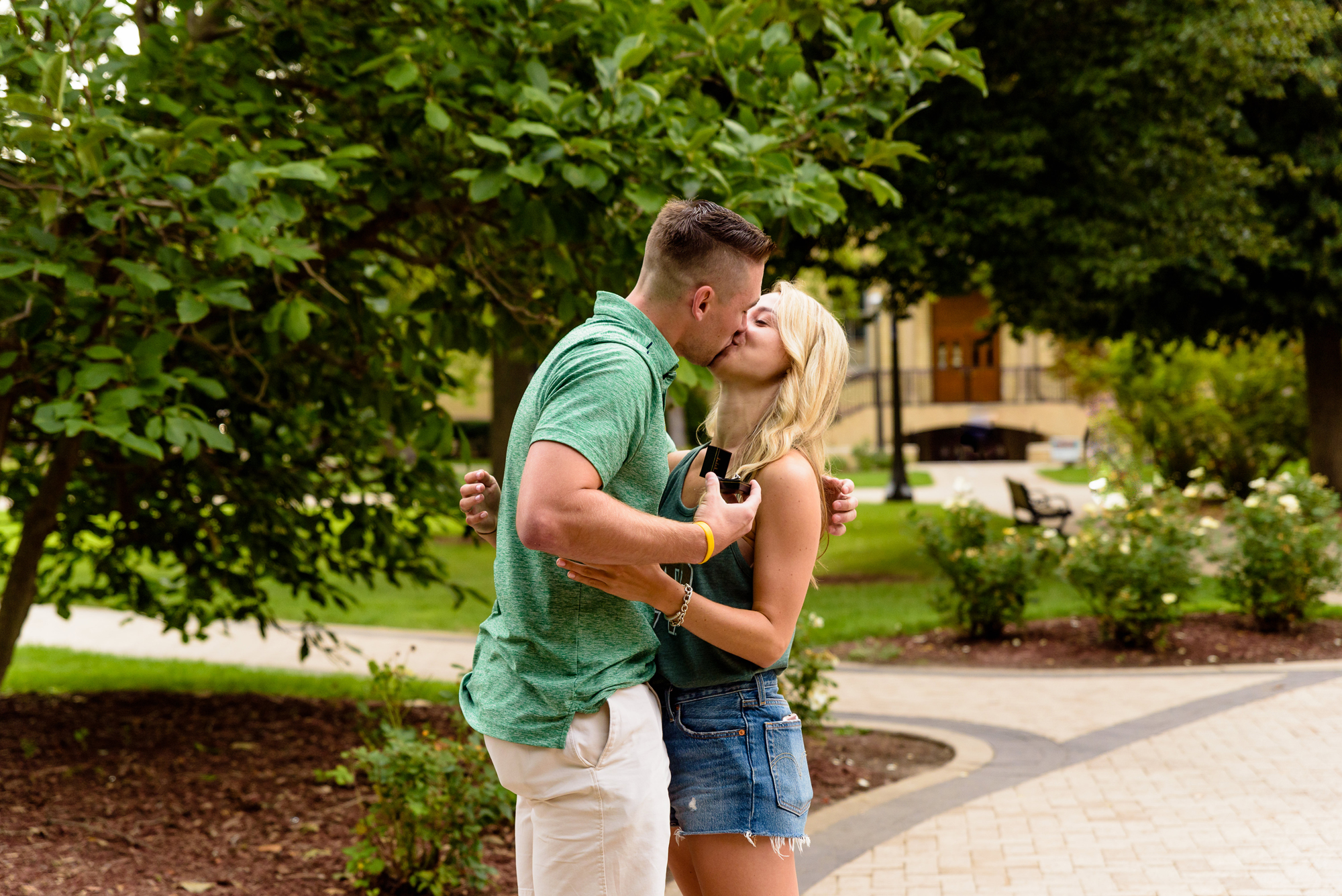 Girlfriend being proposed to in front of the Golden Dome on the campus of University of Notre Dame