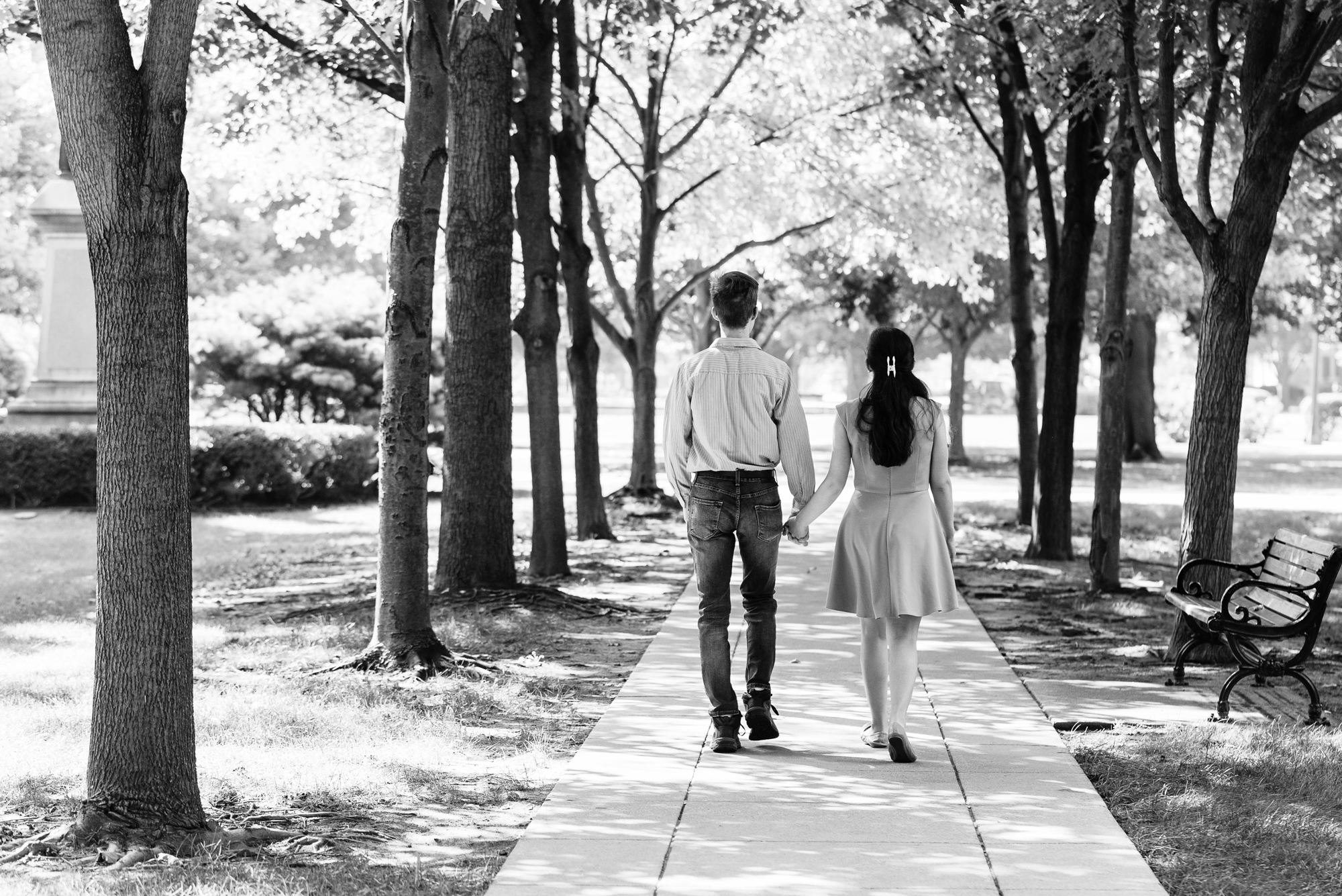 Engaged couple walking God Quad on the campus of the University of Notre Dame