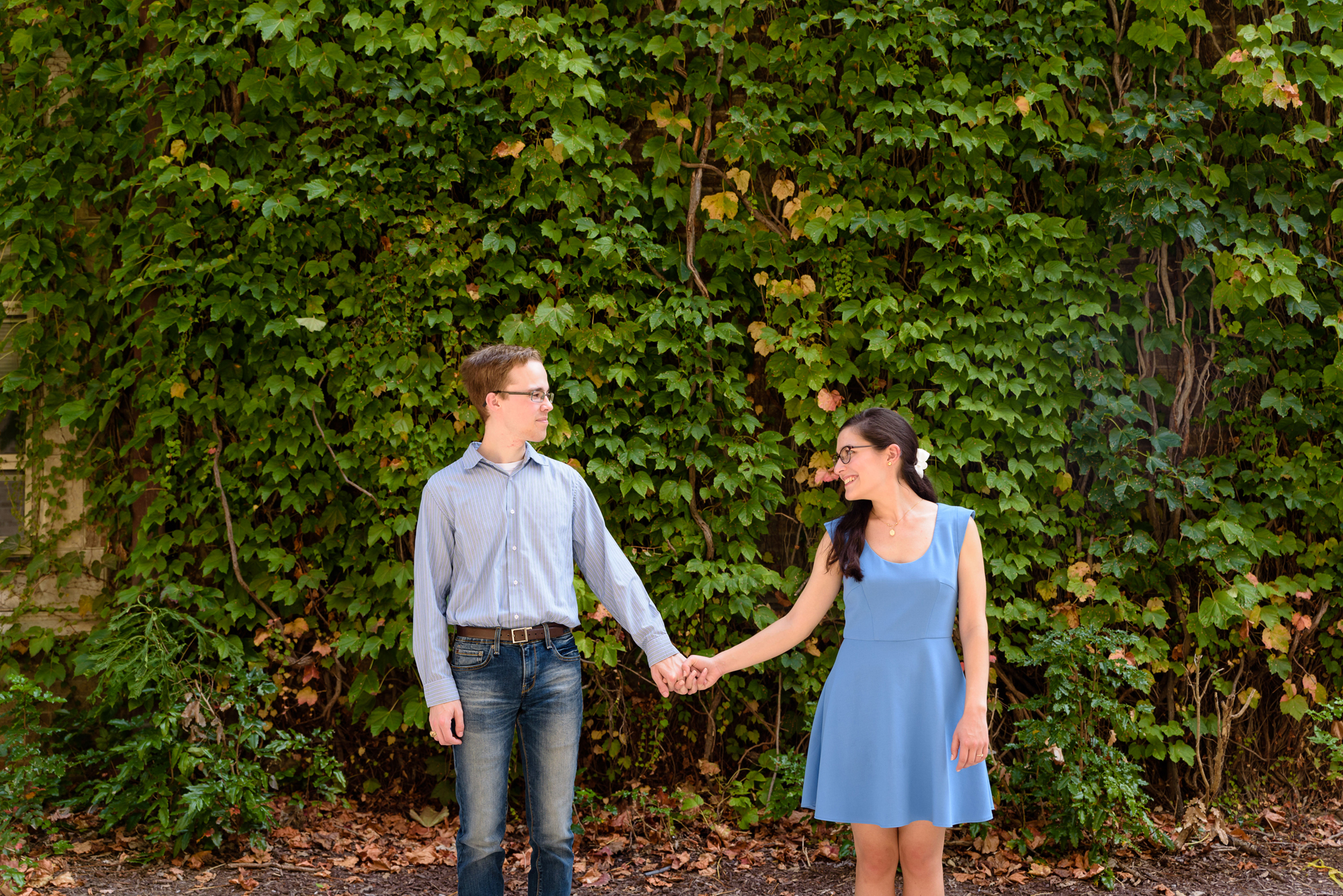 Engaged couple outside Fitzpatrick building on the campus of the University of Notre Dame