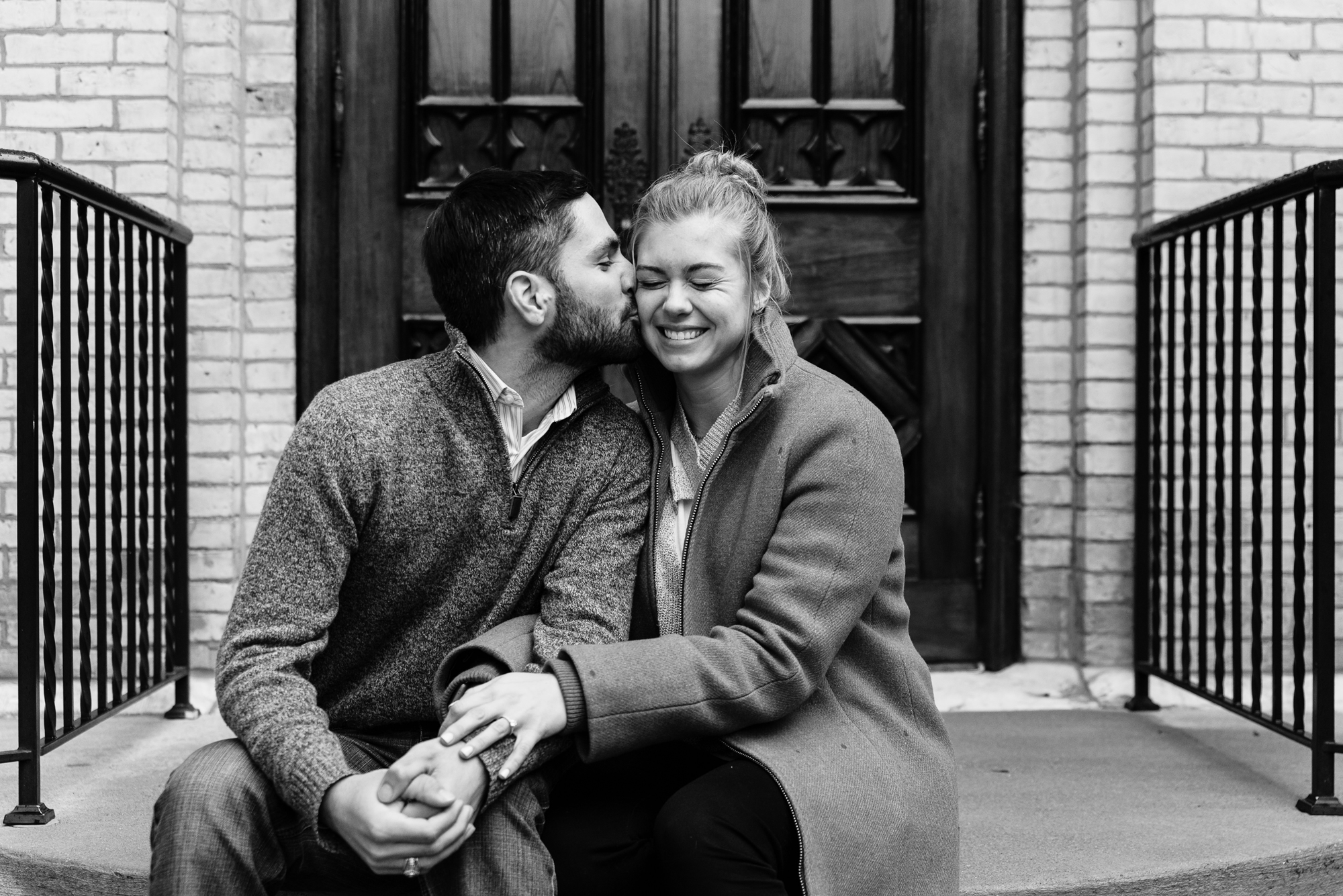Newly engaged couple on the steps of the Basilica of the Sacred Heart on the campus of the University of Notre Dame