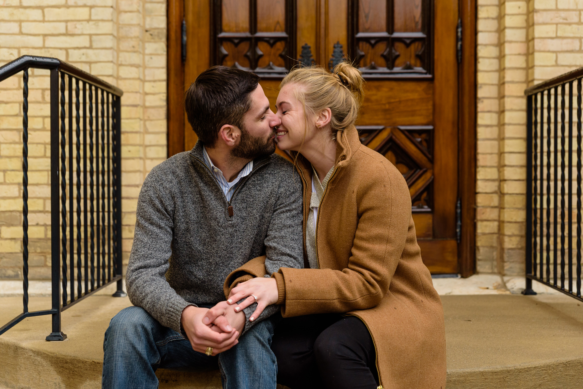 Newly engaged couple on the steps of the Basilica of the Sacred Heart on the campus of the University of Notre Dame