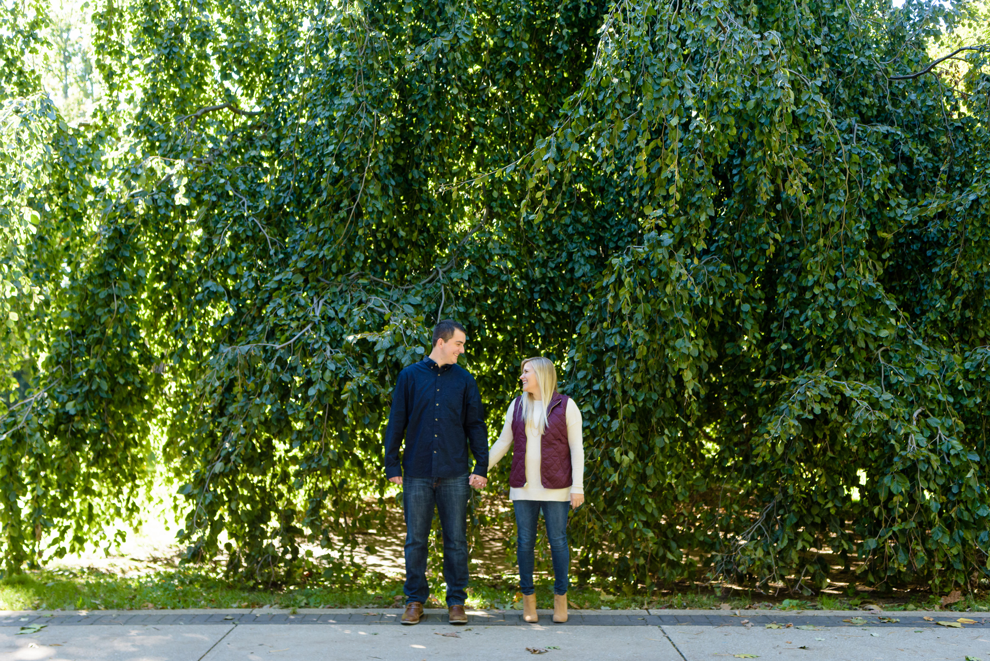 Engaged couple around God Quad on the campus of the University of Notre Dame