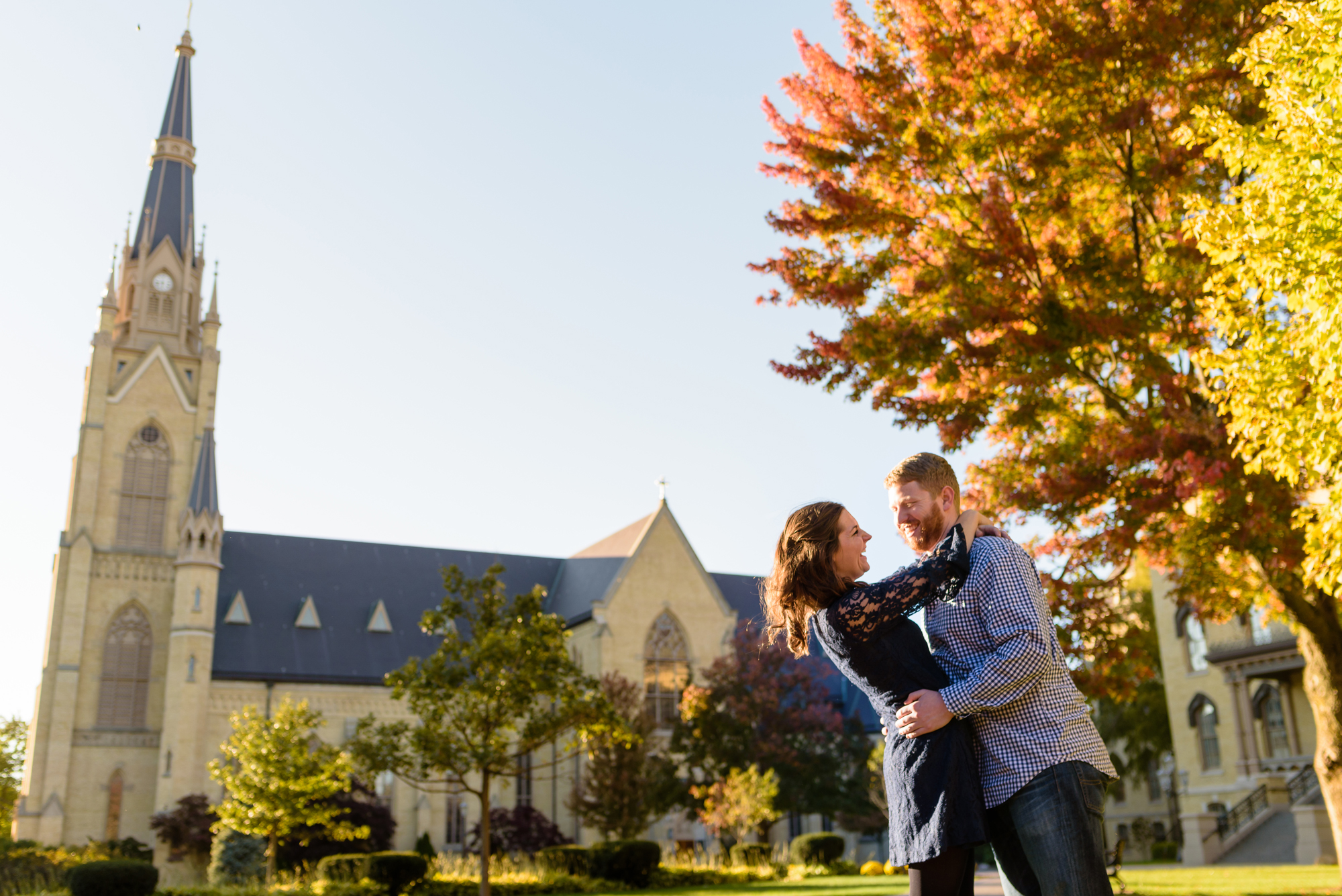 Engaged couple around God Quad on the campus of the University of Notre Dame