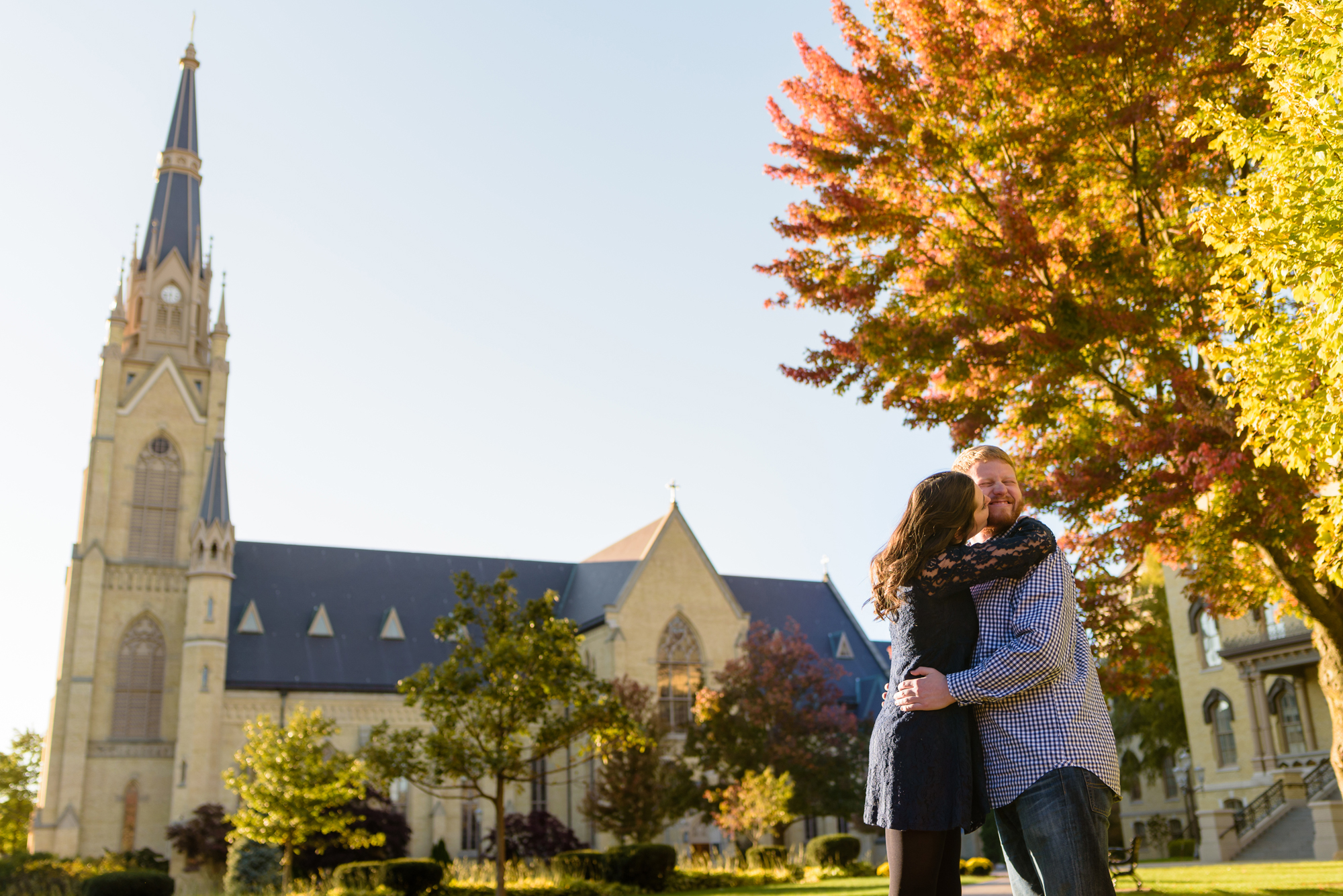 Engaged couple around God Quad on the campus of the University of Notre Dame