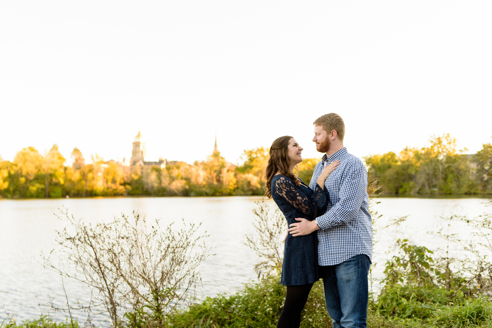 Engaged couple around St. Joseph's Lake on the campus of the University of Notre Dame