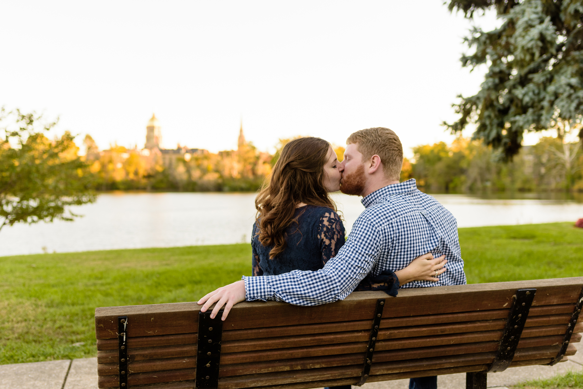 Engaged couple around St. Joseph's Lake on the campus of the University of Notre Dame