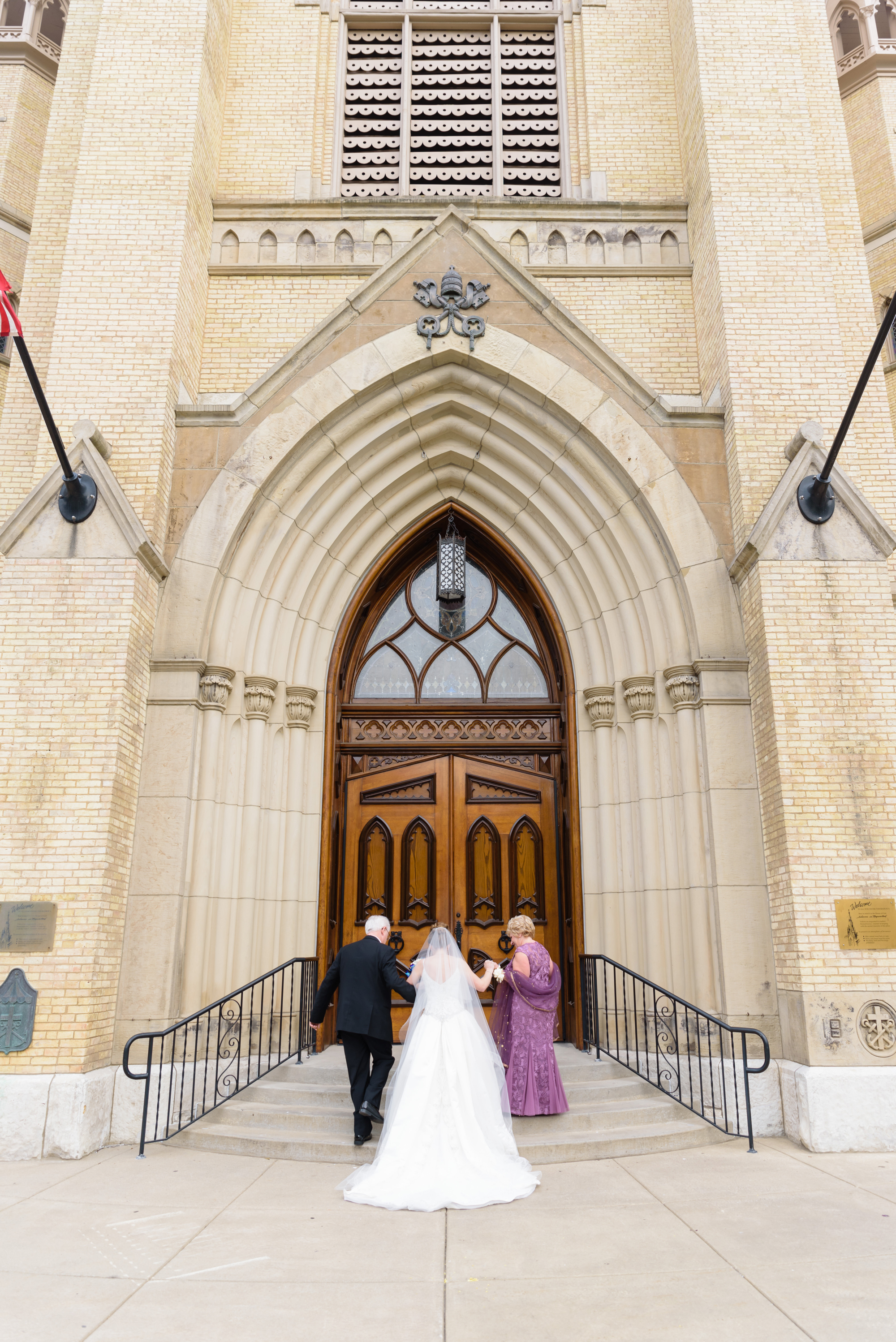 Bride walking into her wedding ceremony at the Basilica of the Sacred Heart on the campus of the University of Notre Dame