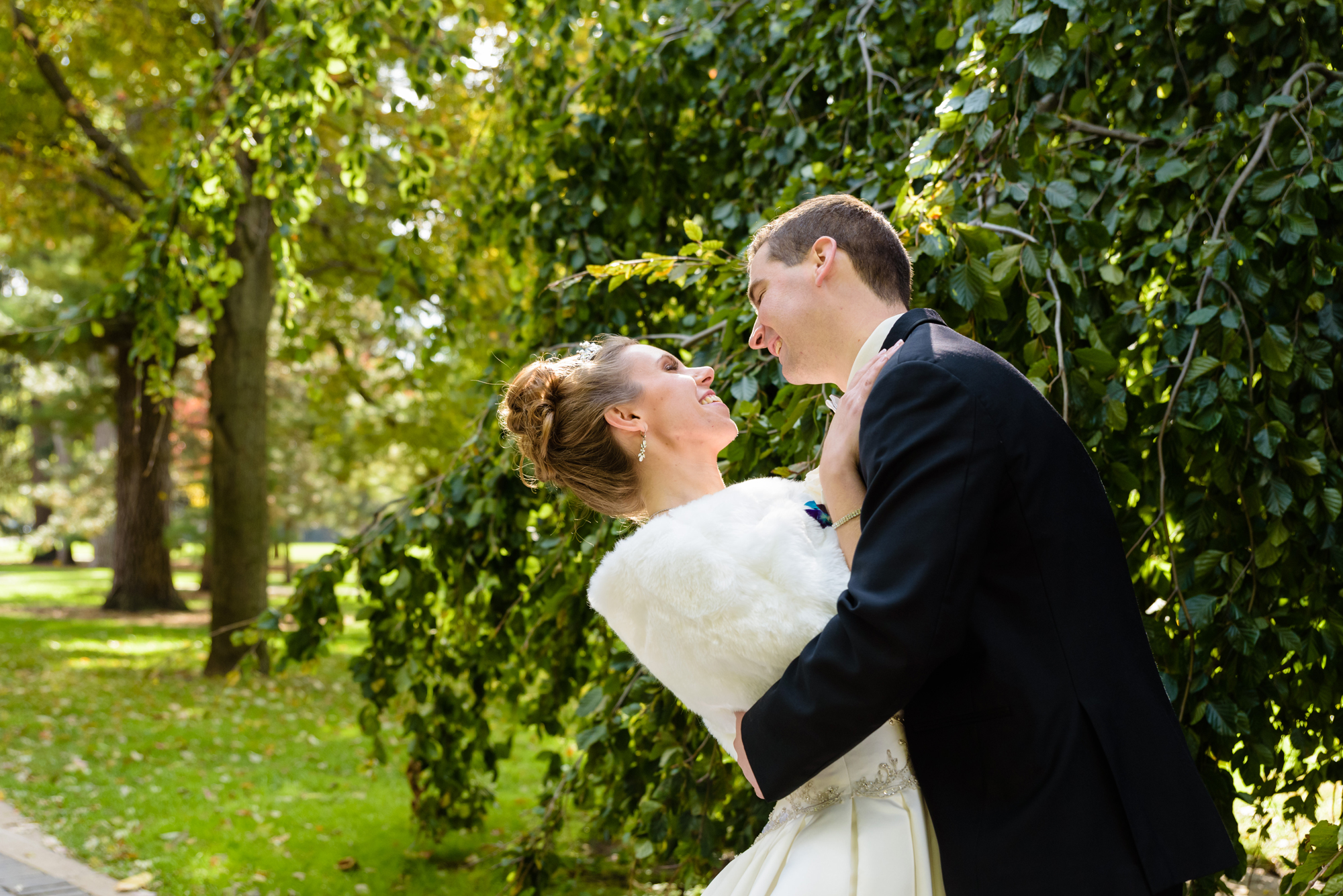 Bride & Groom around God Quad after their wedding ceremony at the Basilica of the Sacred Heart on the campus of the University of Notre Dame