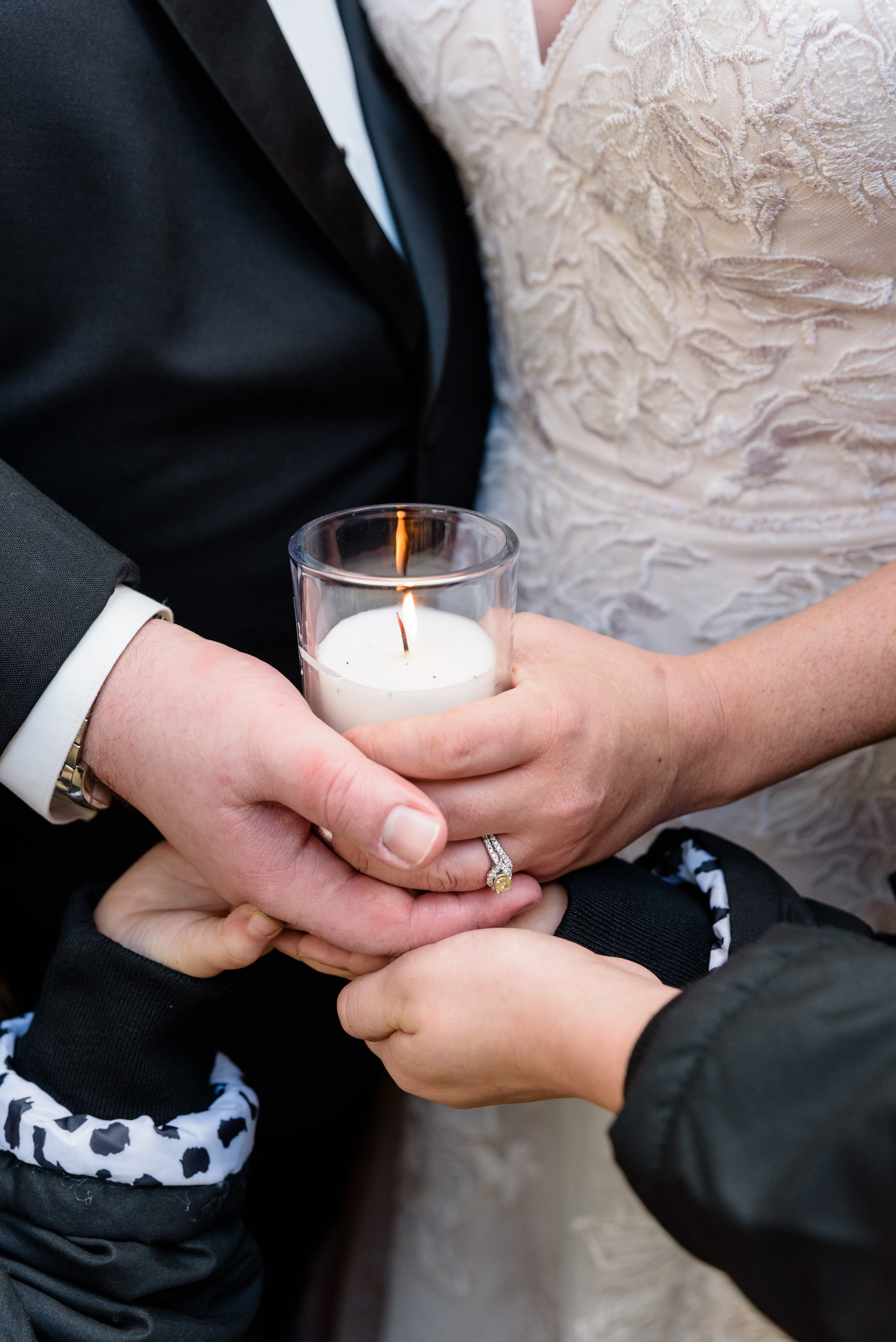 Bride & Groom lighting a candle at the Grotto after their wedding ceremony at the Basilica of the Sacred Heart on the campus of the University of Notre Dame