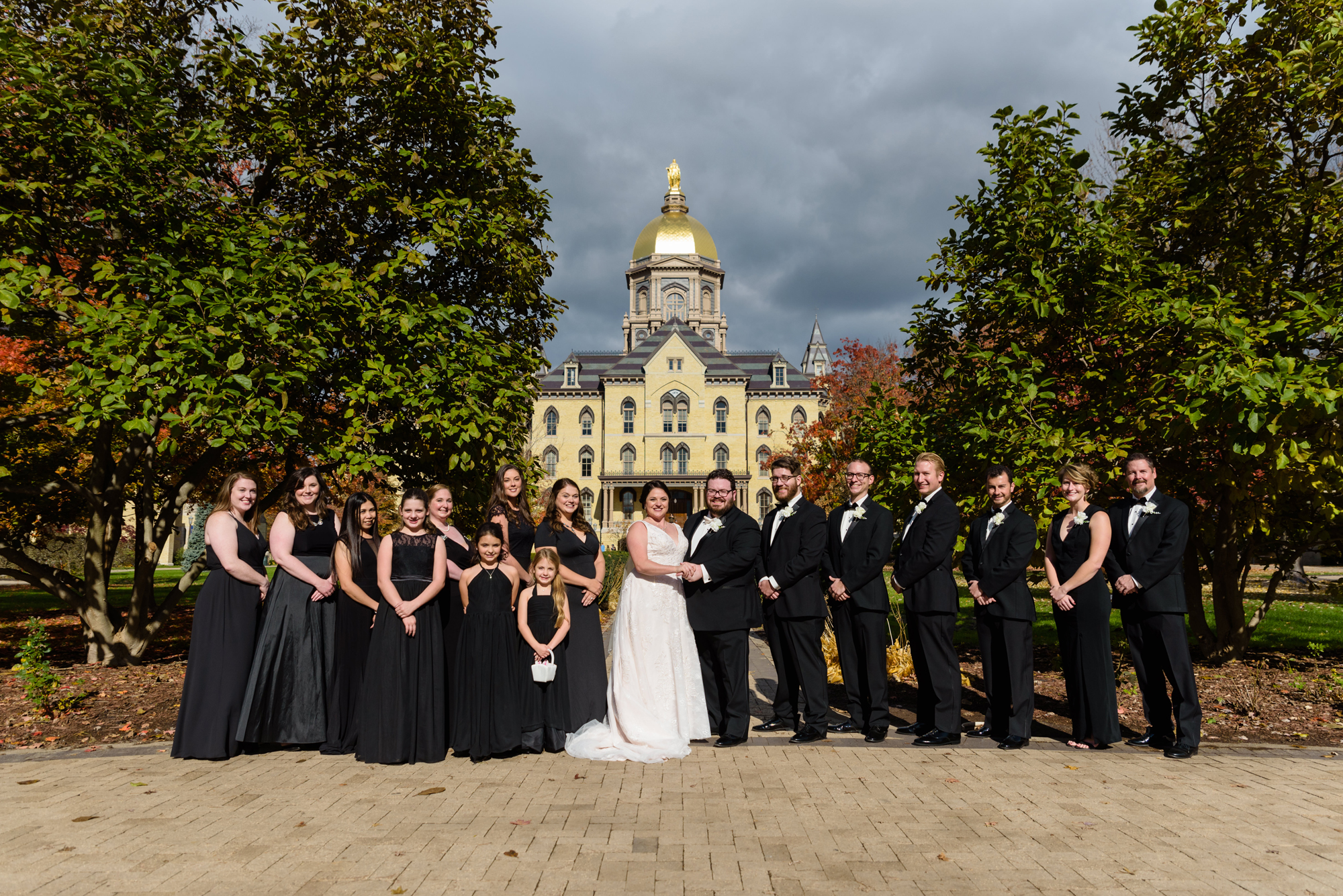 Bridal Party in front of Golden Dome after their wedding ceremony at the Basilica of the Sacred Heart on the campus of the University of Notre Dame