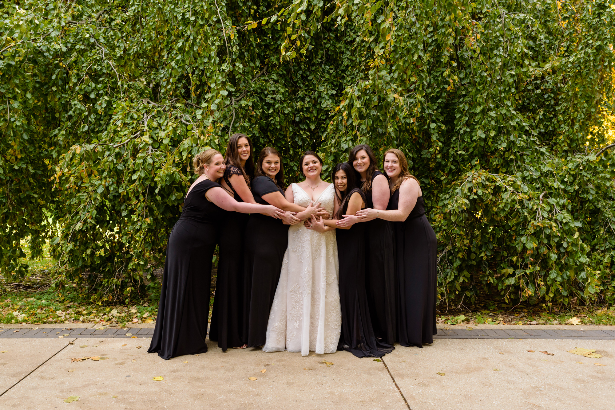 Bridesmaids around God Quad after their wedding ceremony at the Basilica of the Sacred Heart on the campus of the University of Notre Dame