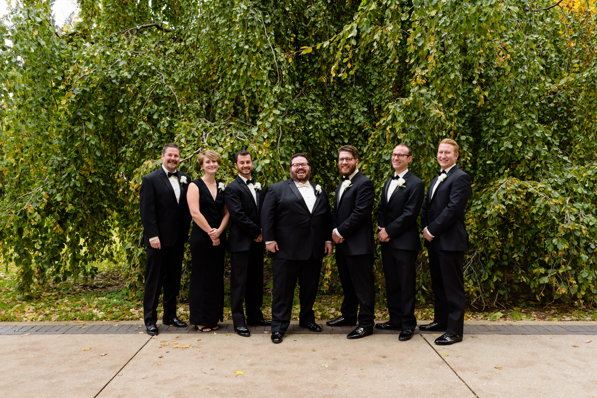 Groomsmen around God Quad after their wedding ceremony at the Basilica of the Sacred Heart on the campus of the University of Notre Dame