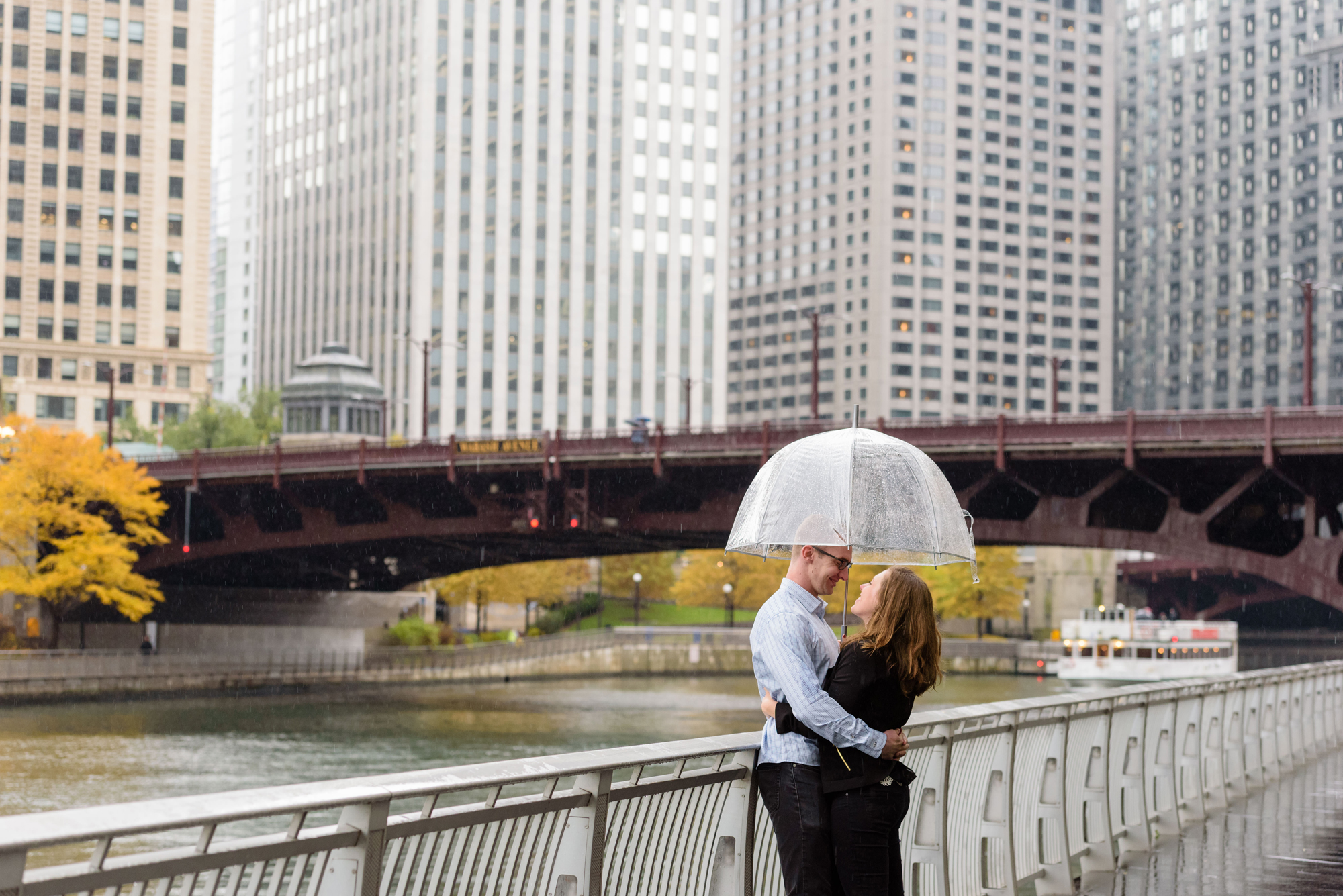 Engaged couple along the riverwalk downtown Chicago