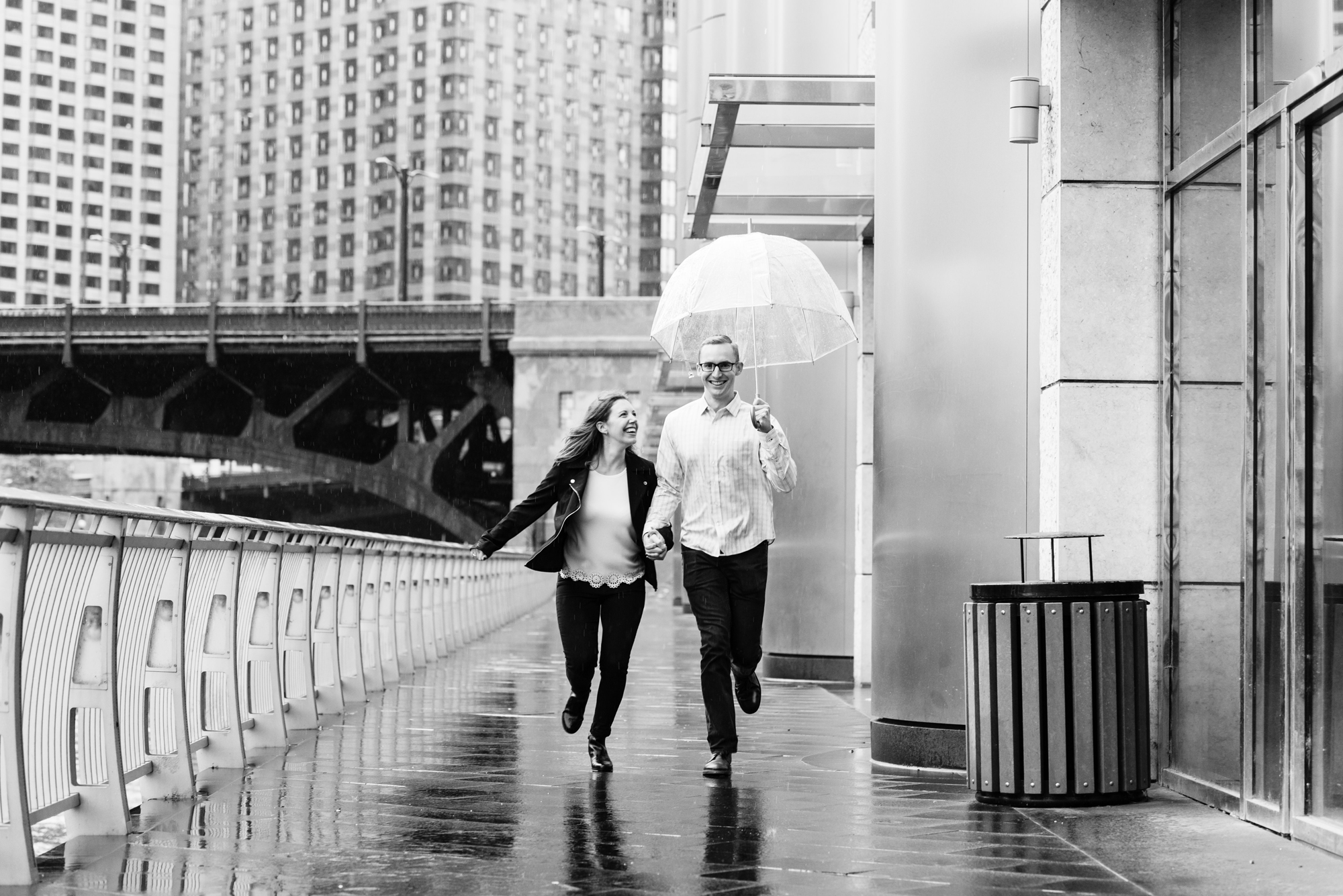 Engaged couple along the riverwalk downtown Chicago