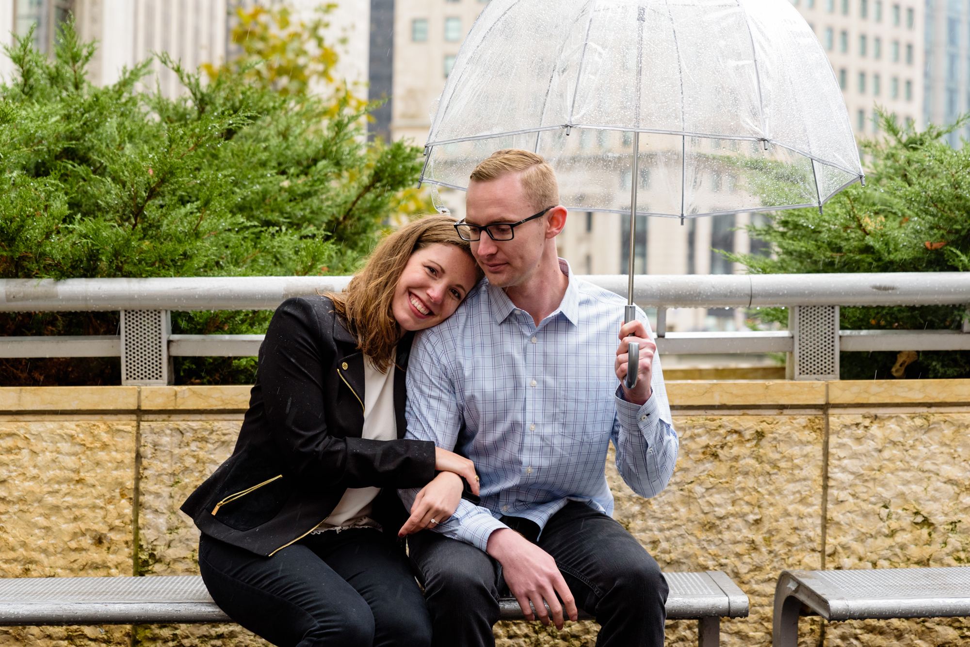 Engaged couple along the riverwalk downtown Chicago