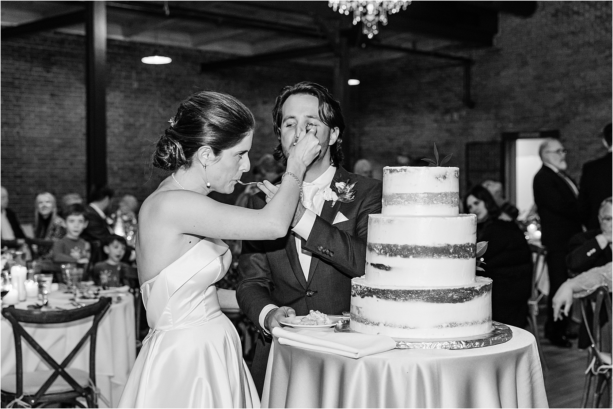 068-Caitlin-Kevin-Katie-Whitcomb-Photography-classic-elegant-the-armory-winter-wedding-cake-cutting.jpg